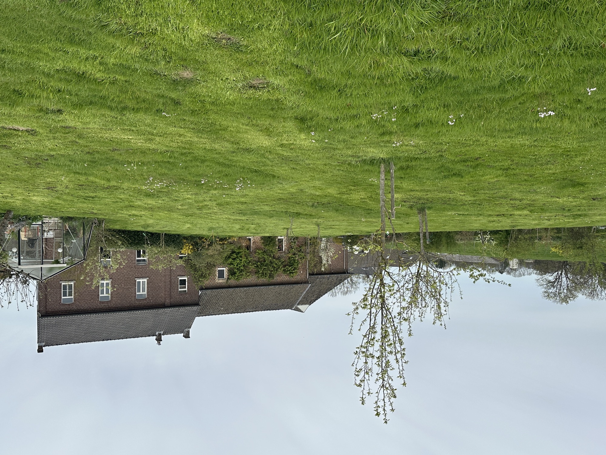 The No. 5 residence in the background with part of its garden